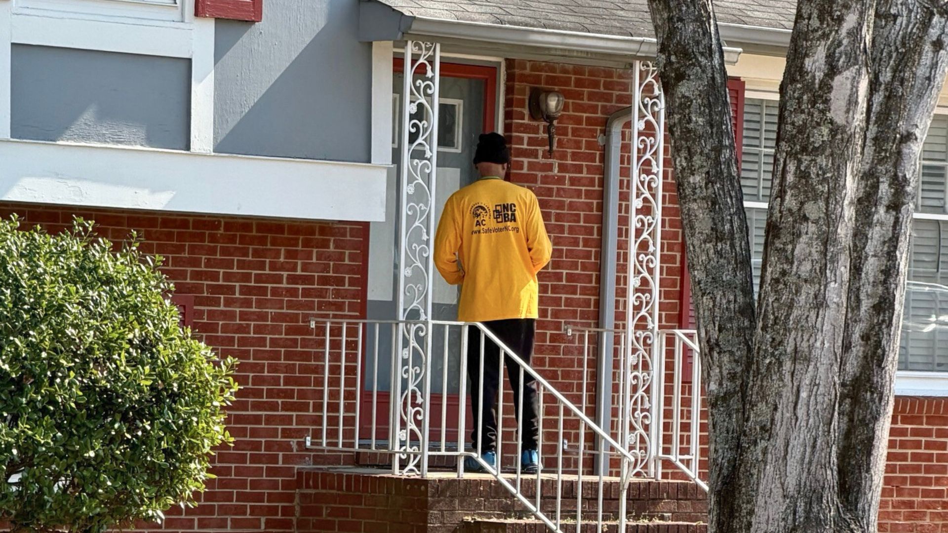 Advance Carolina canvasser knocking on door during primary election